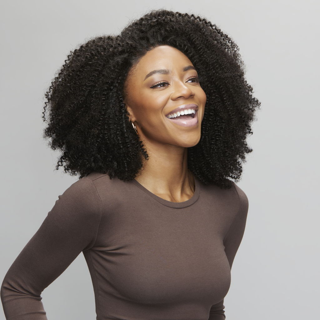 Back view of a Brazilian curly sew-in finished with a 5x5 HD closure