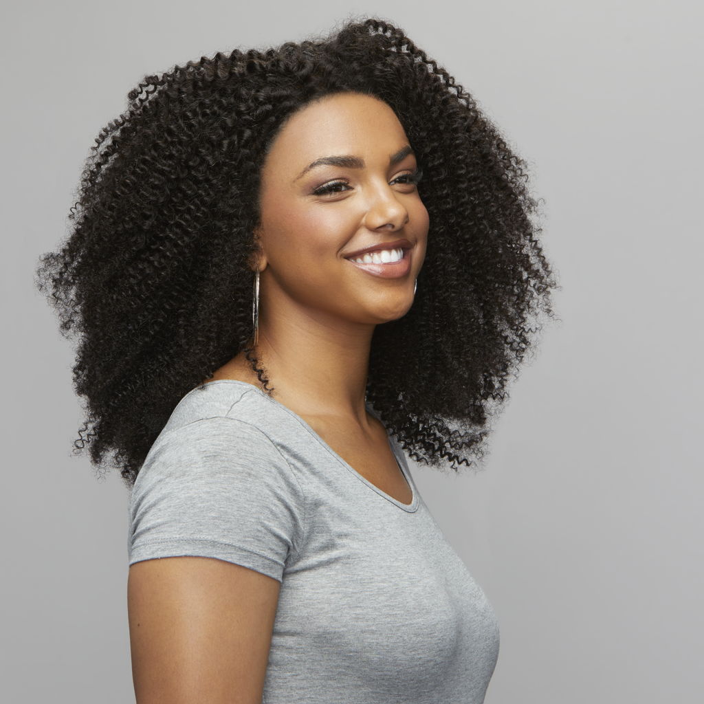 Back view of a Brazilian curly install finished with a lace frontal