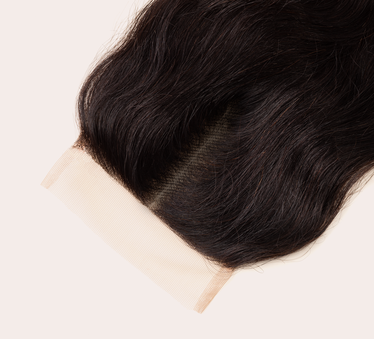 Side view of a loose wave sew-in finished with a 4x4 closure