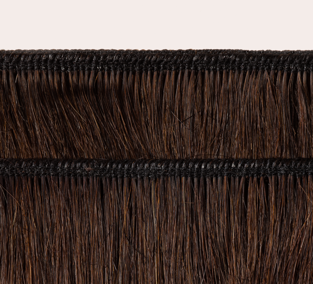 Side view of a chocolate brown deep wave install past the shoulder
