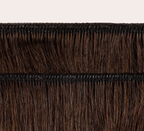 Side view of a chocolate brown deep wave install past the shoulder