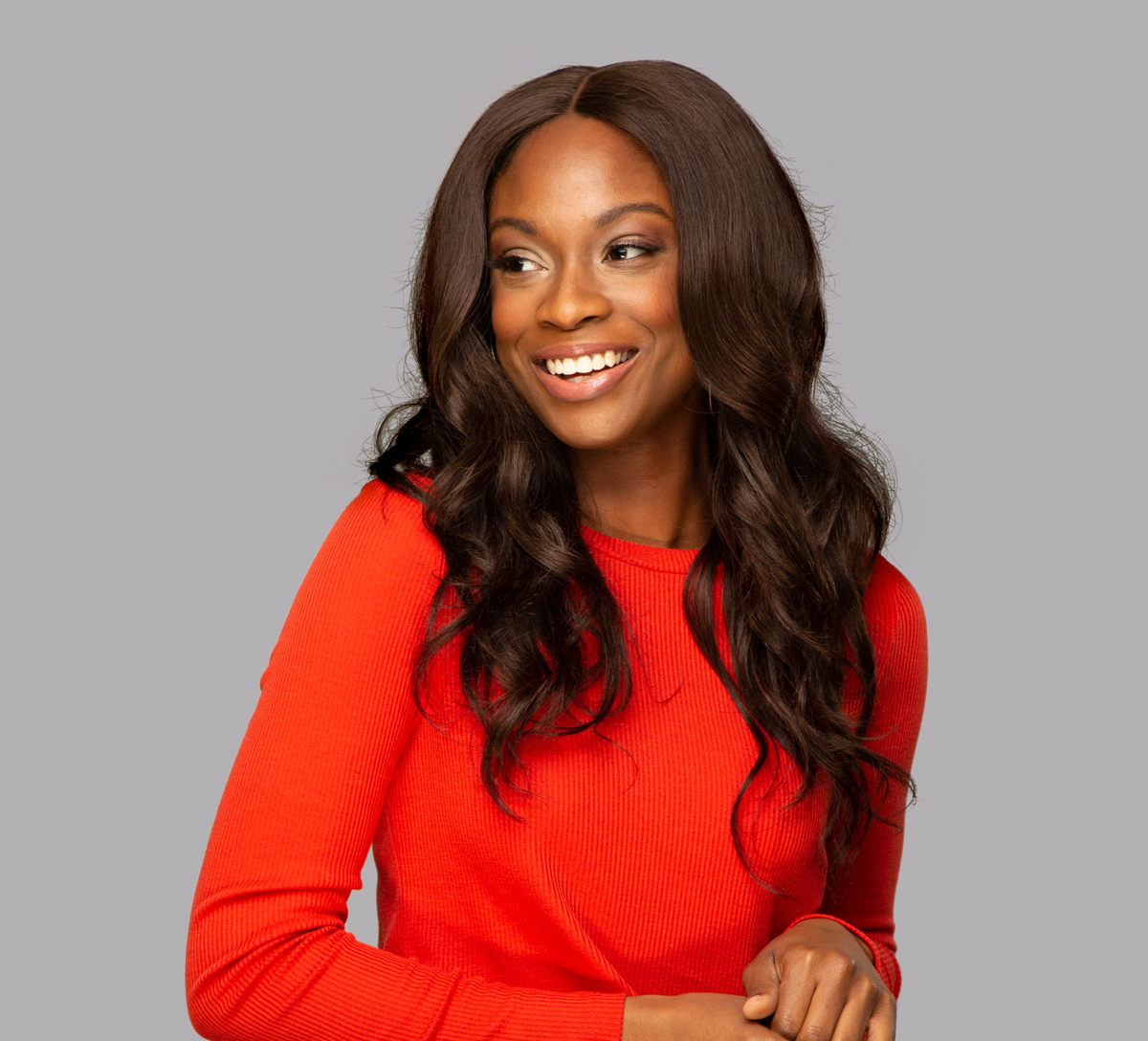 Model wearing a 2 chocolate brown body wave sew-in, front view