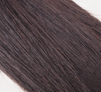 Dark brown human hair swatch clipped onto the stylist sample ring