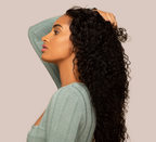 Model wearing a natural black water wave 13x4 transparent lace frontal