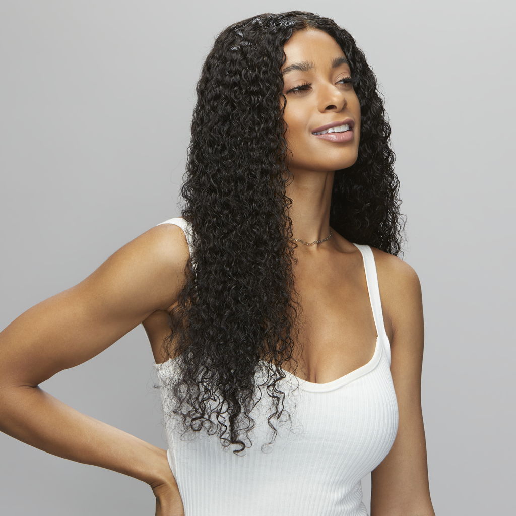 Back view of a water wave sew-in finished with a 5x5 HD closure