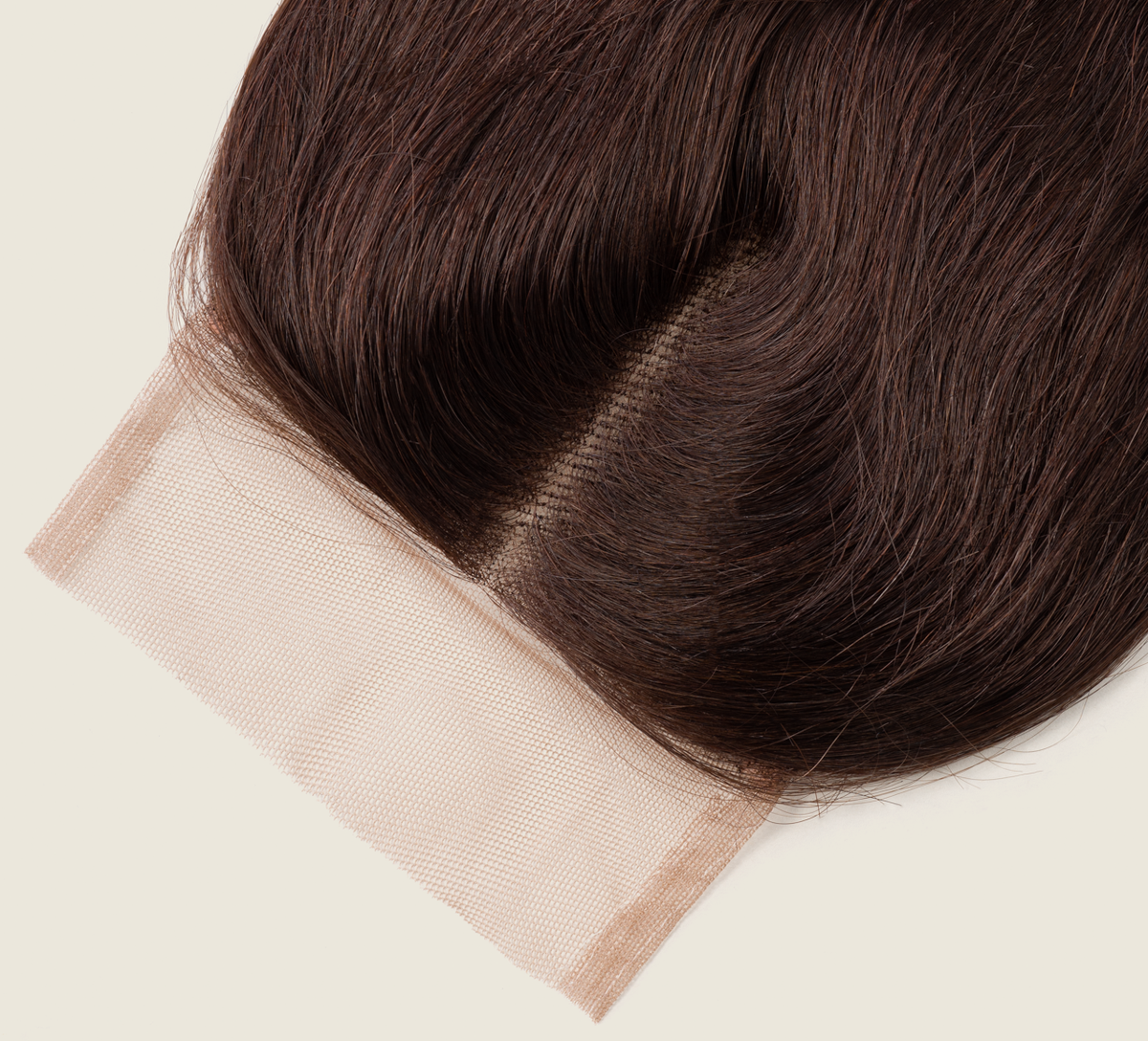 Close-up of transparent lace on a chocolate brown body wave closure