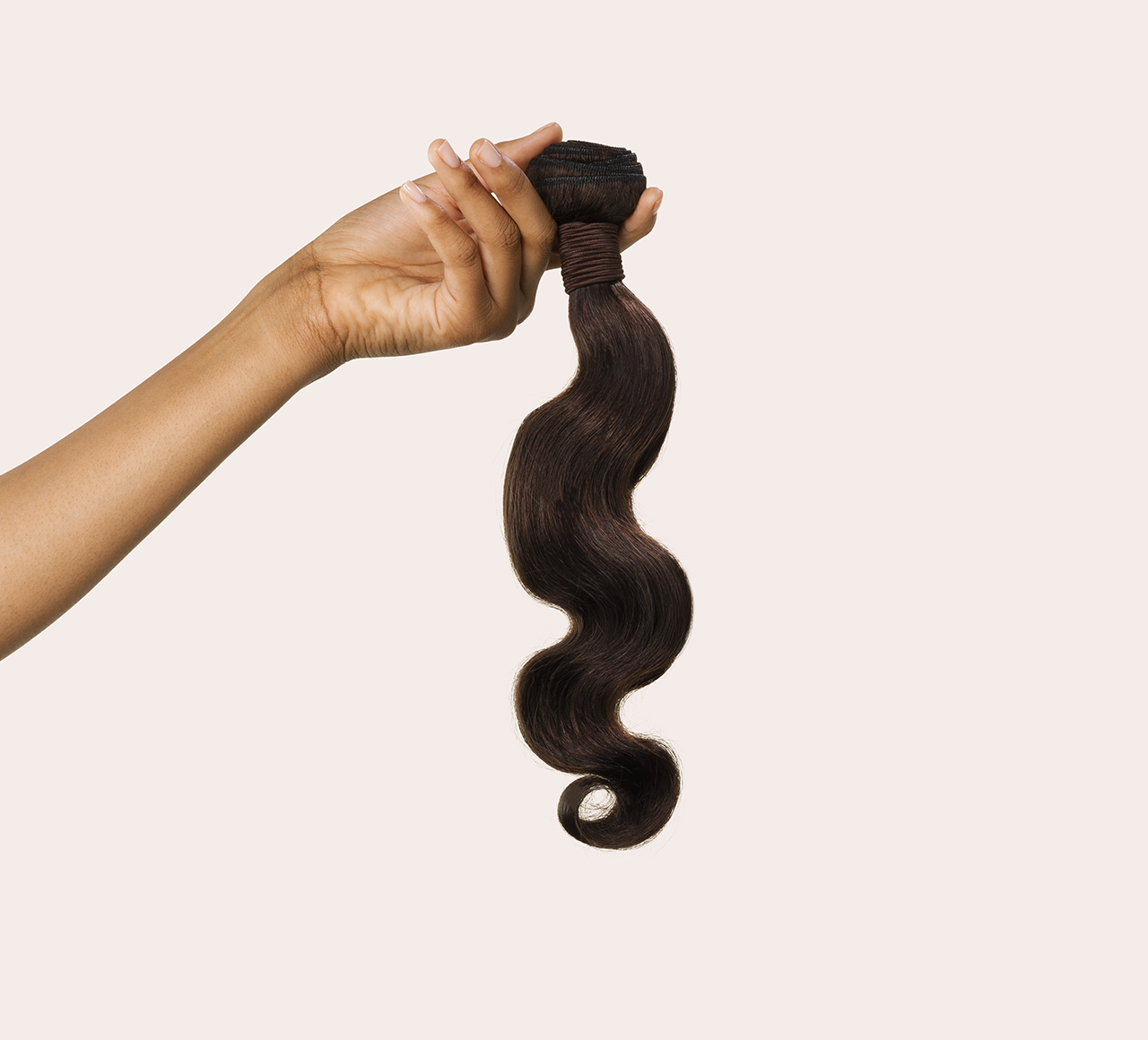 Side view of a chocolate brown body wave install past the shoulder