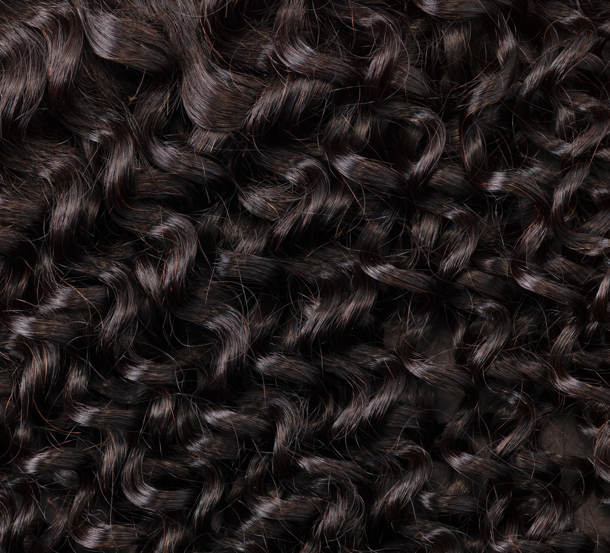 Model wearing a natural black water wave 4x4 HD lace closure