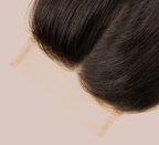 Close-up of the transparent lace parting space on a 4x4 straight closure