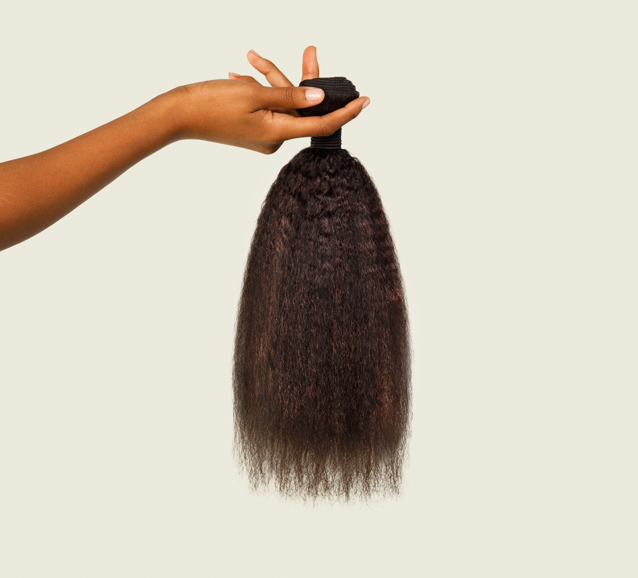 Side view of a natural black kinky straight install blended with natural hair