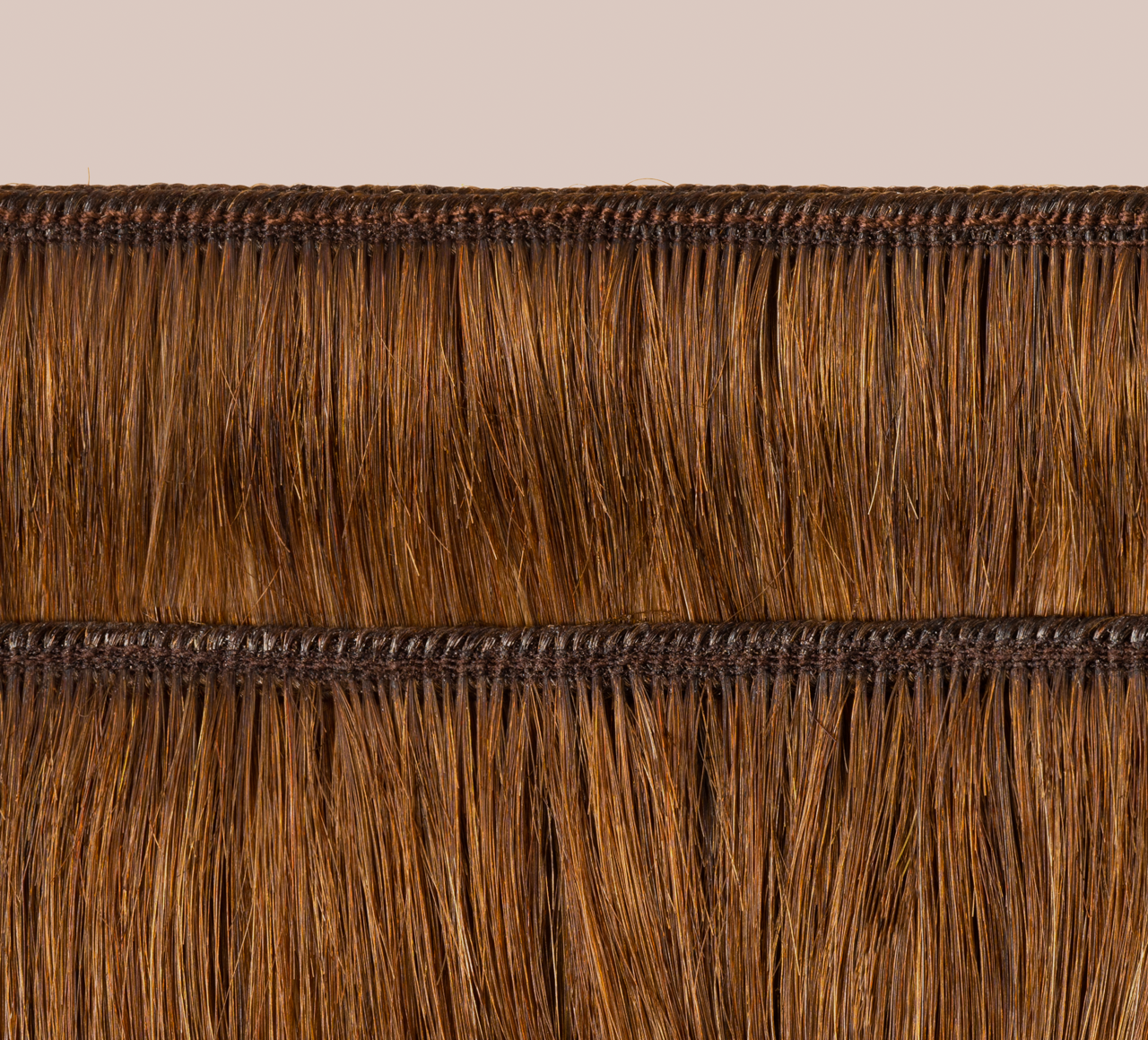 Side view of a caramel brown loose wave install past the shoulder