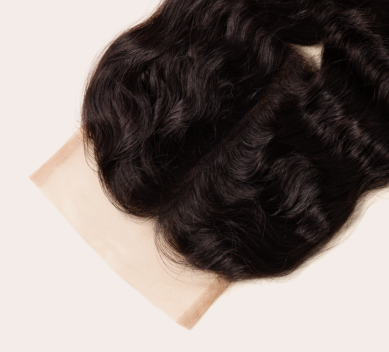 Close-up of the transparent lace and bleached knots on a 4x4 closure