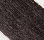 Fanned display of virgin human hair swatches on a metal sample ring