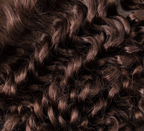 Back view of a chocolate brown deep wave sew-in showing curl definition