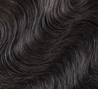 Back view of a jet black body wave install with a 5x5 closure