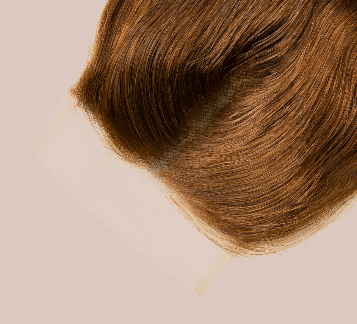 Close-up of transparent lace on a caramel brown loose wave closure