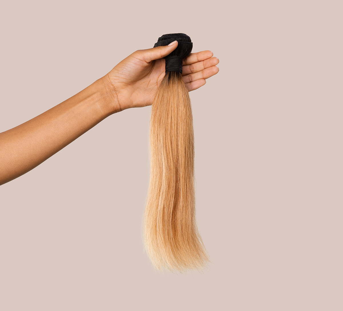 Close-up of the dark root melting into honey blonde straight lengths