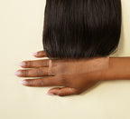 Natural black Brazilian straight 5x5 HD lace closure laid flat on white