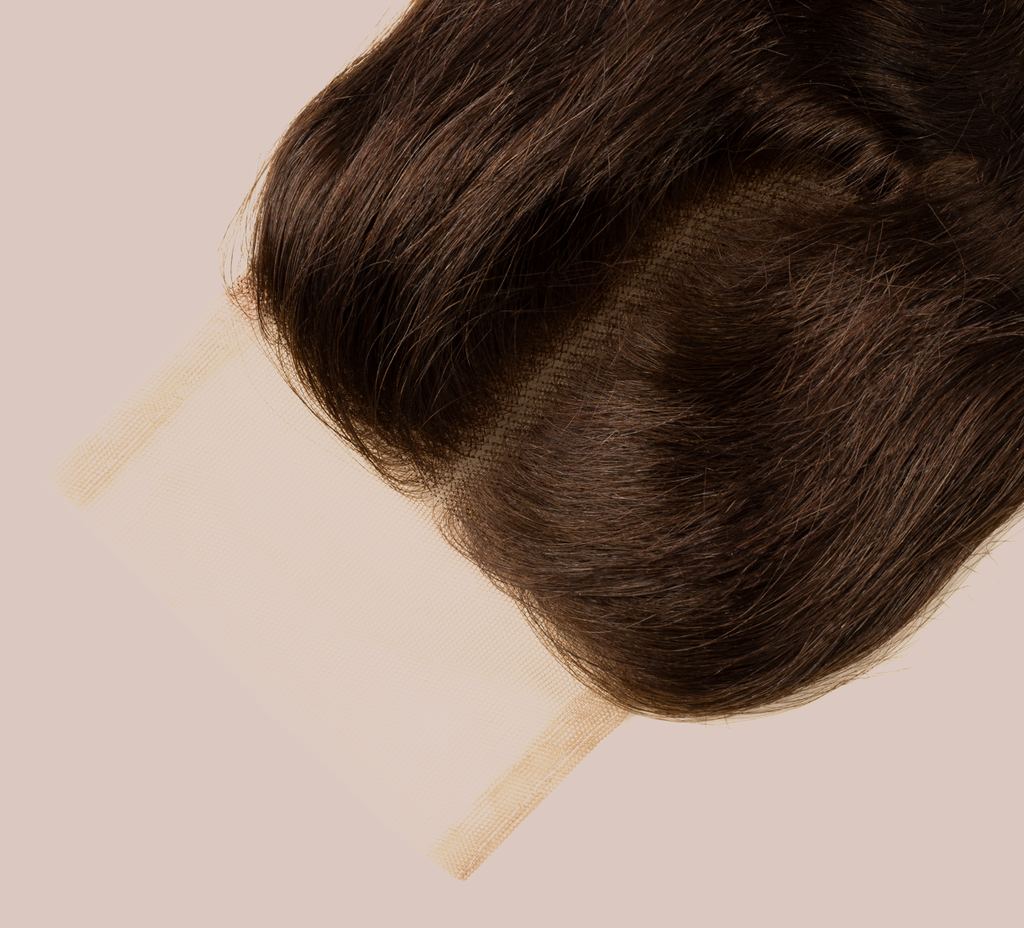 Close-up of transparent lace on a chocolate brown loose wave closure