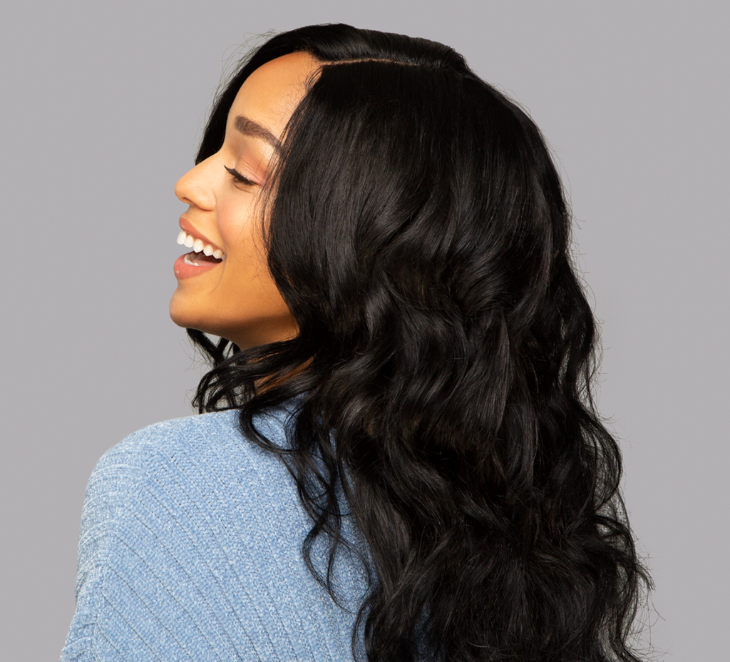 Model wearing a jet black body wave 5x5 HD lace closure