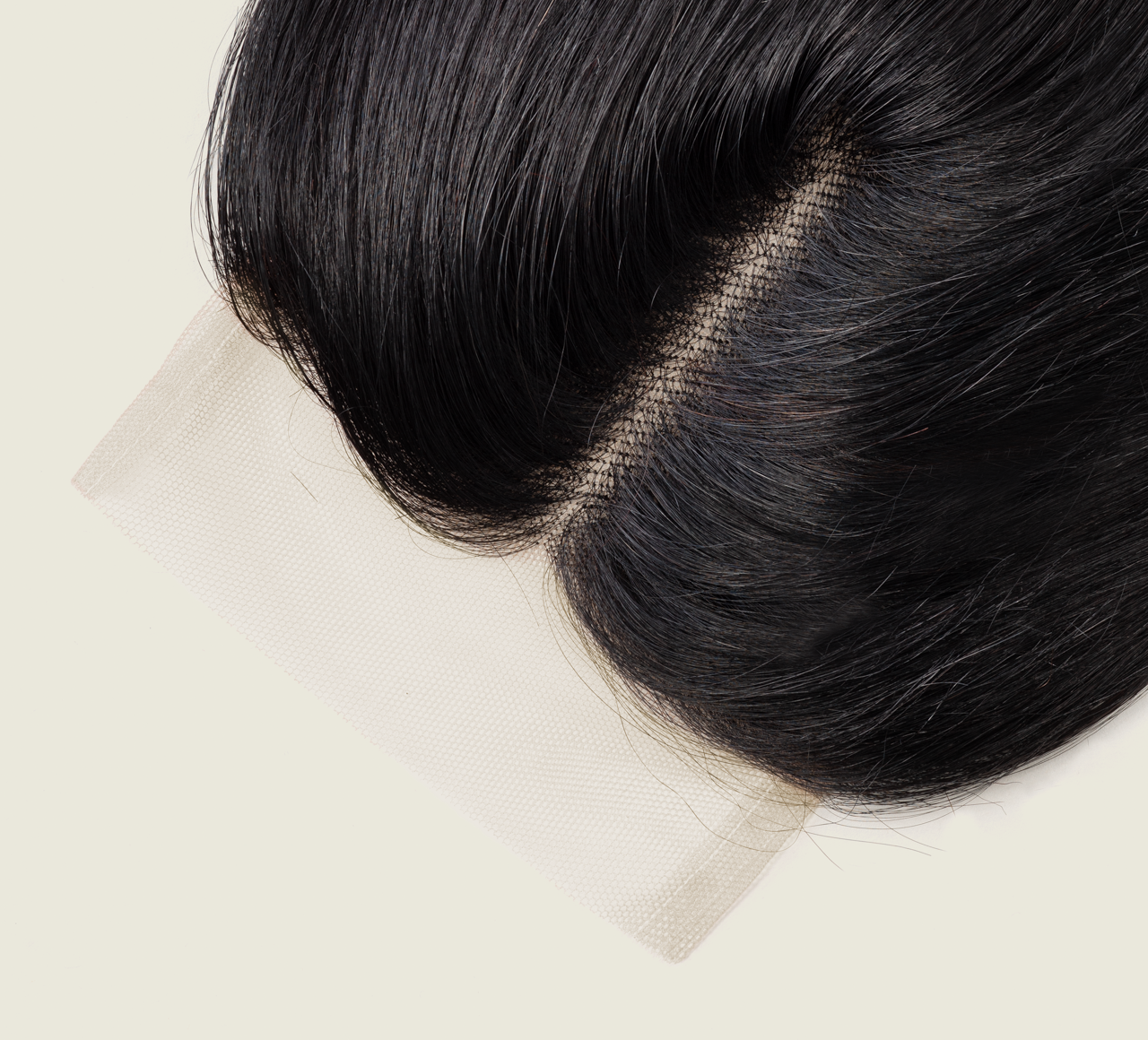Close-up of transparent lace on a jet black straight closure