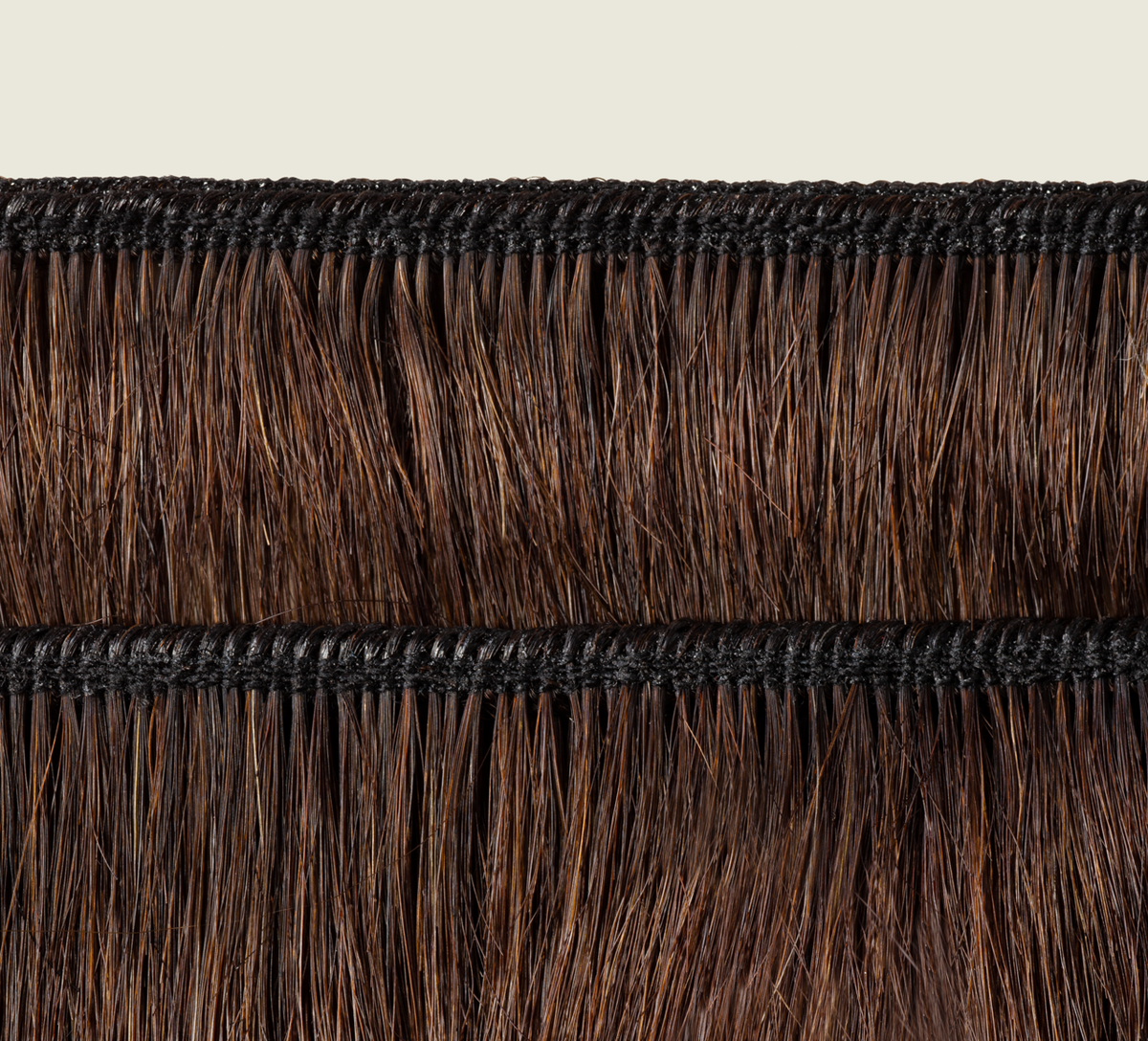 Back view of a chocolate brown body wave sew-in showing rich tone