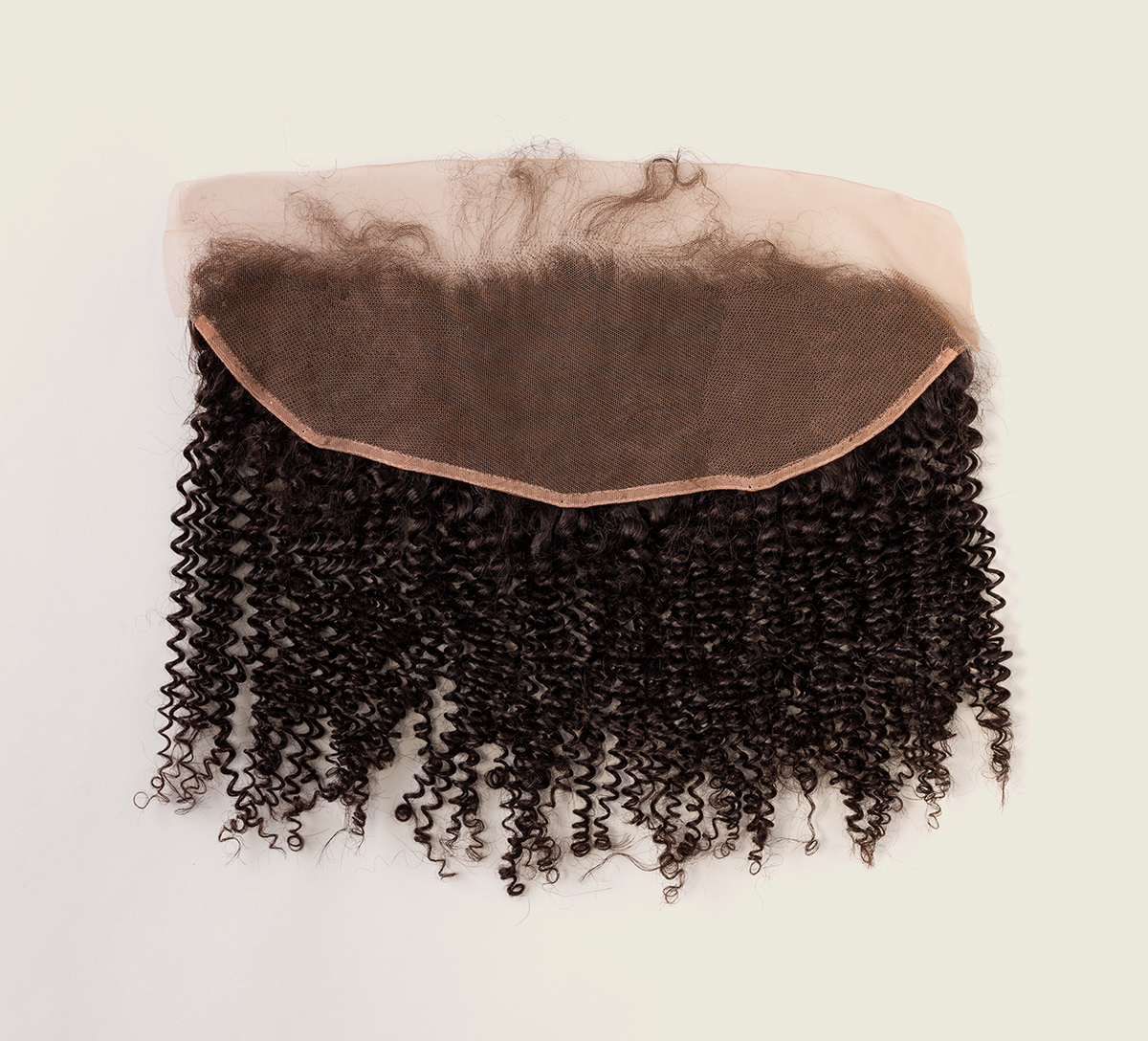 Color swatch of natural black virgin Brazilian curly frontal hair shown flat