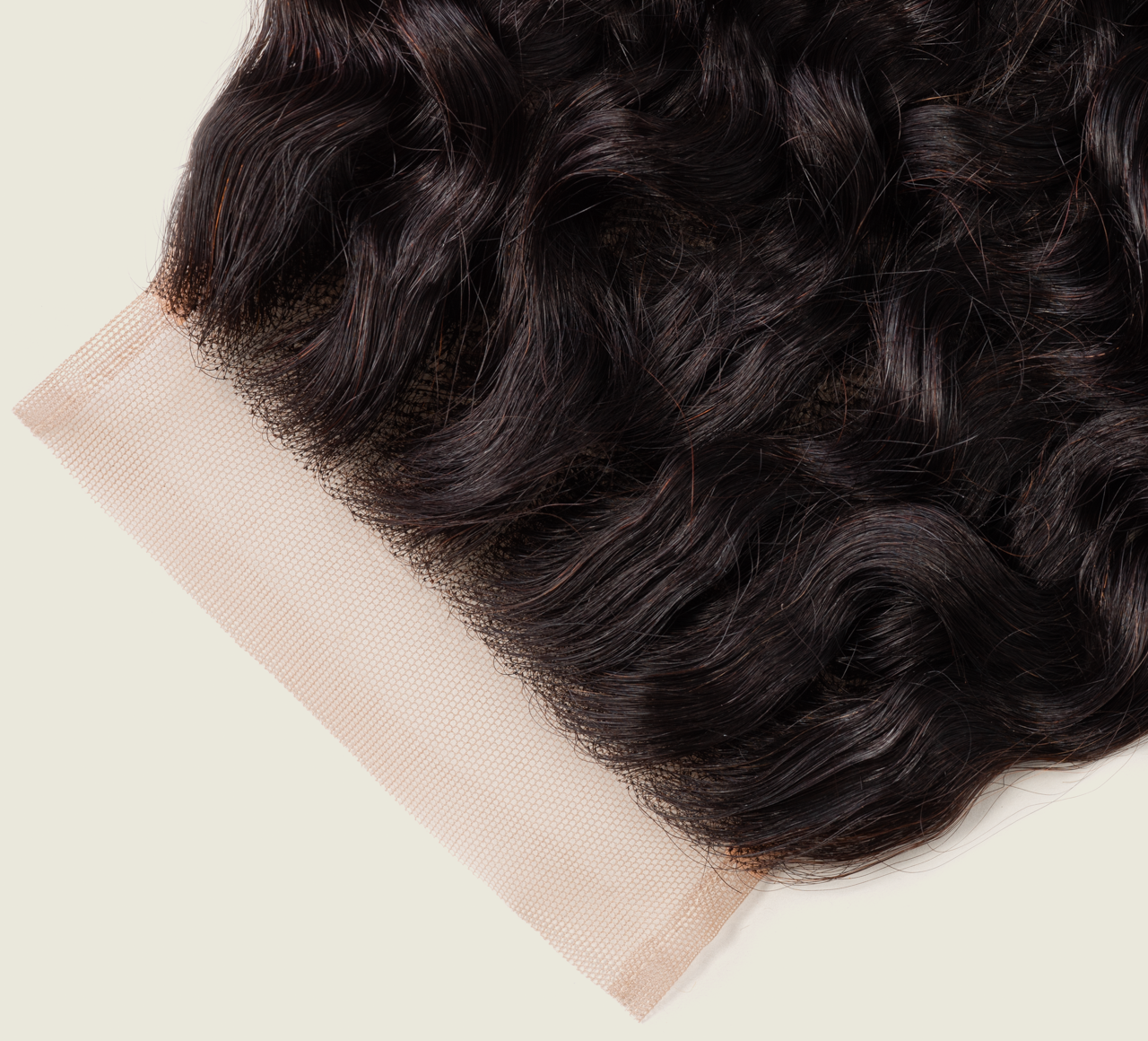 Close-up of the tousled water wave pattern on a 4x4 lace closure