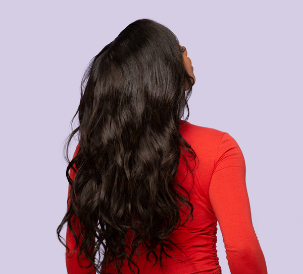 Close-up of loose S-shaped body wave curls on virgin Malaysian hair