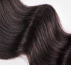 Blonde human hair swatch shown against darker swatches on the ring