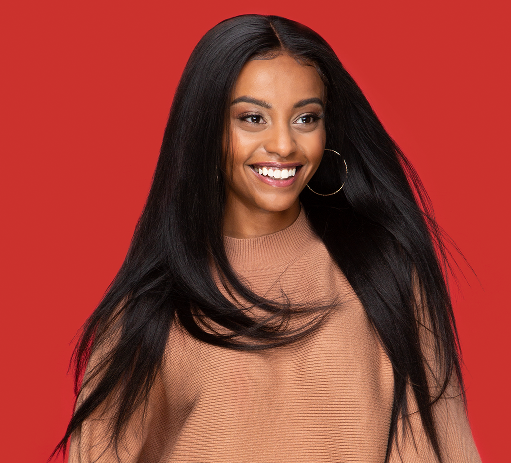Side view of a natural black yaki straight install blended with natural hair