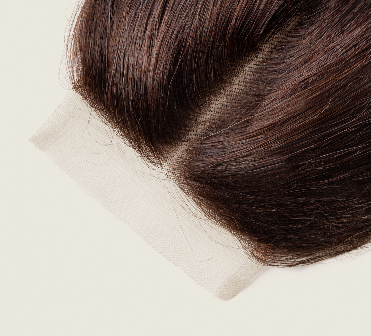 Close-up of transparent lace on a chocolate brown straight closure