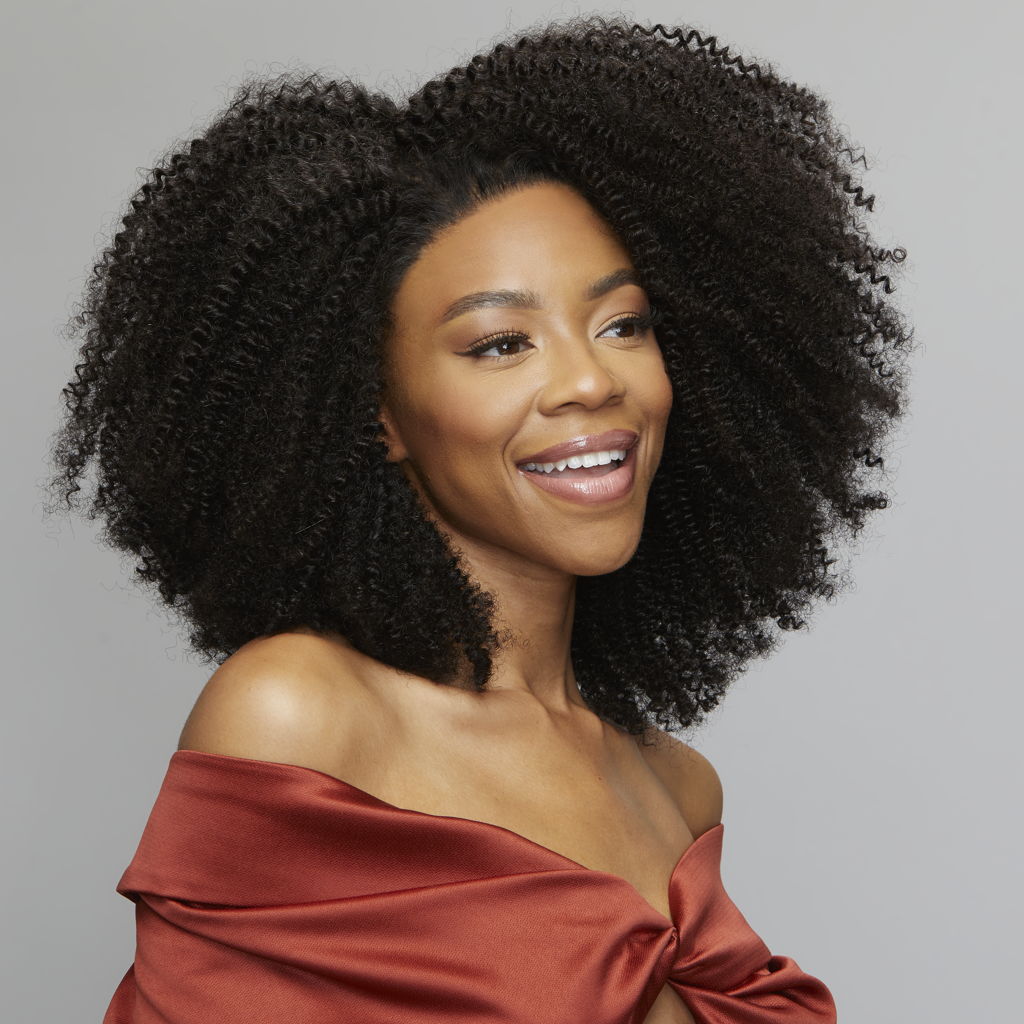 Close-up of tight coils framing the HD lace on a curly closure