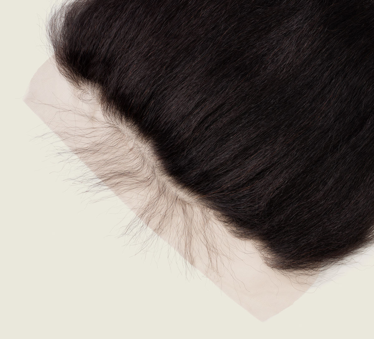 Close-up of transparent lace along a kinky straight frontal hairline