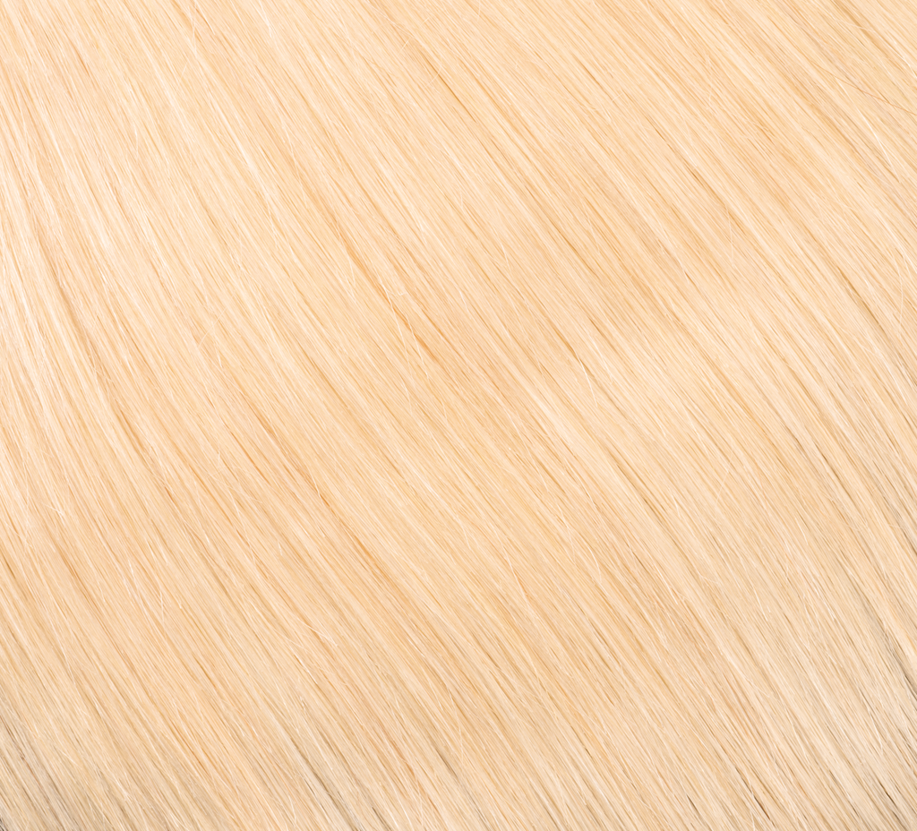 Blonde 613 Indian straight hair photographed against a plain background