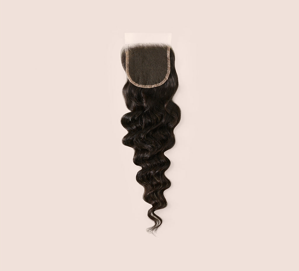 Color swatch of natural black virgin Brazilian loose wave HD closure hair