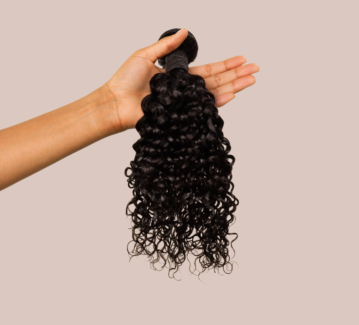 Model wearing a natural black Brazilian water wave sew-in, front view