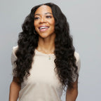 Back view of a Brazilian loose wave sew-in finished with an HD closure