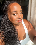 Model wearing Brazilian water wave hair in a half-up braided style