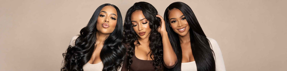 Three women with long, styled black and brown wavy virgin hair bundles are shown from the chest up against a solid light purple background.