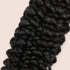 Close-up of the spiral water wave curl pattern in natural black