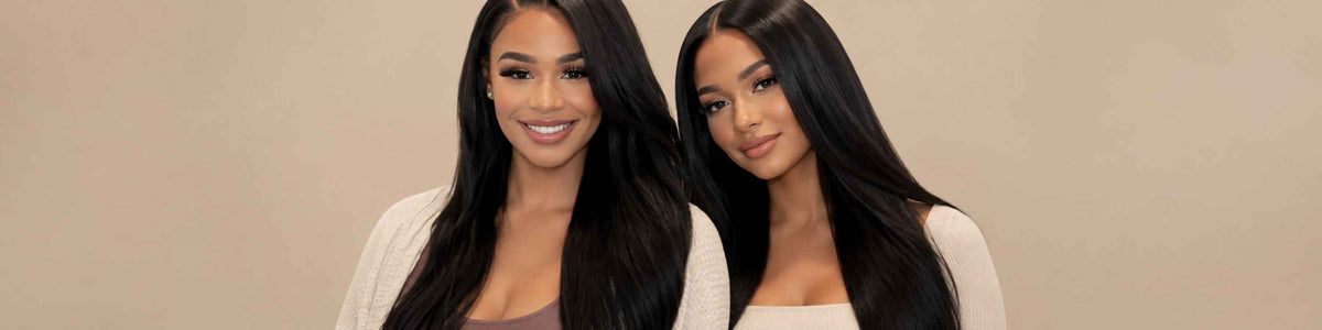 Two women with long, yaki straight, black hair posing against a solid beige background. The image appears horizontally compressed, showing a very wide aspect ratio.